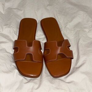 Size: 8.5 new and never worn Brown Slide Sandals